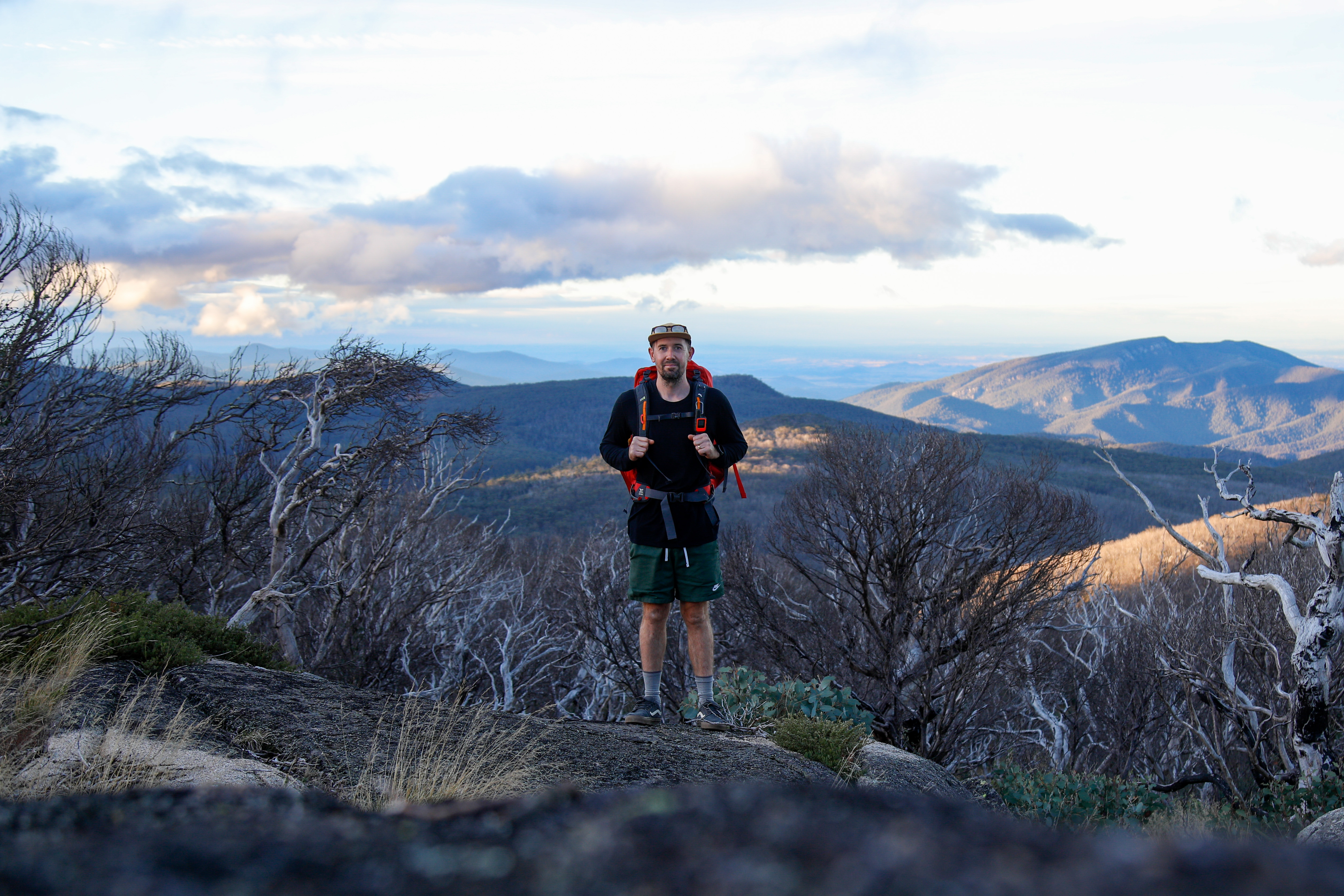 hiker standing on top of mount gingera in Canberra